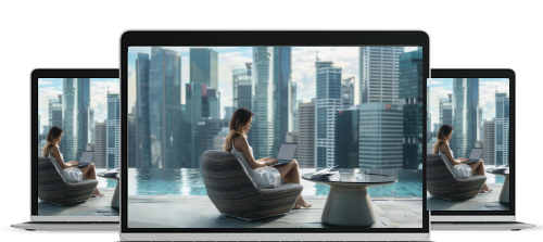 Modern laptops displaying an image of a woman working on a laptop by an outdoor pool with a city skyline background.