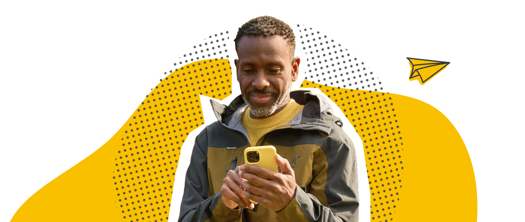 Man in yellow sweater and jacket looking at a yellow smartphone with a yellow paper plane graphic in the background.