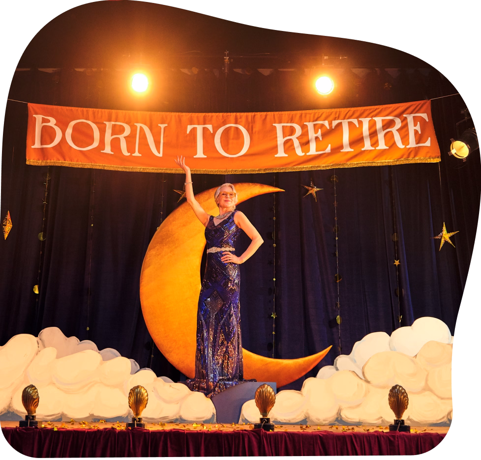 Jane singing on a stage with banner saying 'born to retire' above