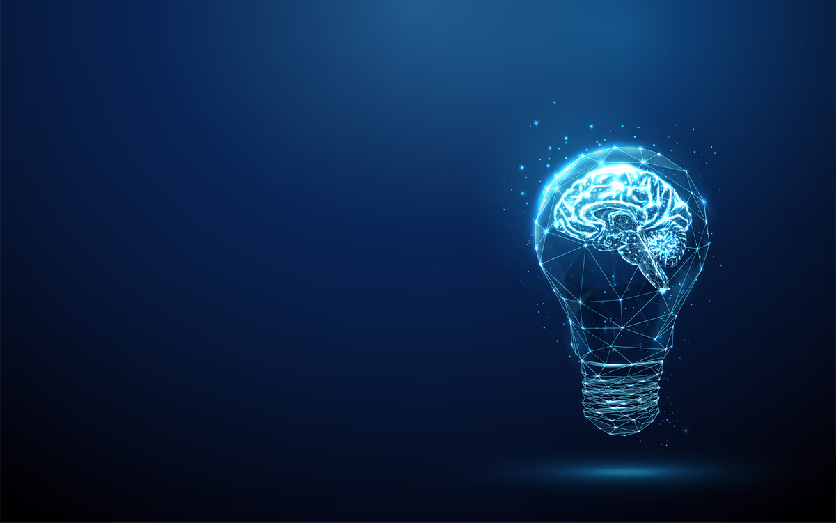 Glowing digital wireframe light bulb with a human brain inside on a dark blue background.