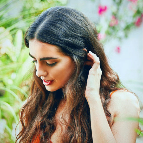 A girl arranges her hair