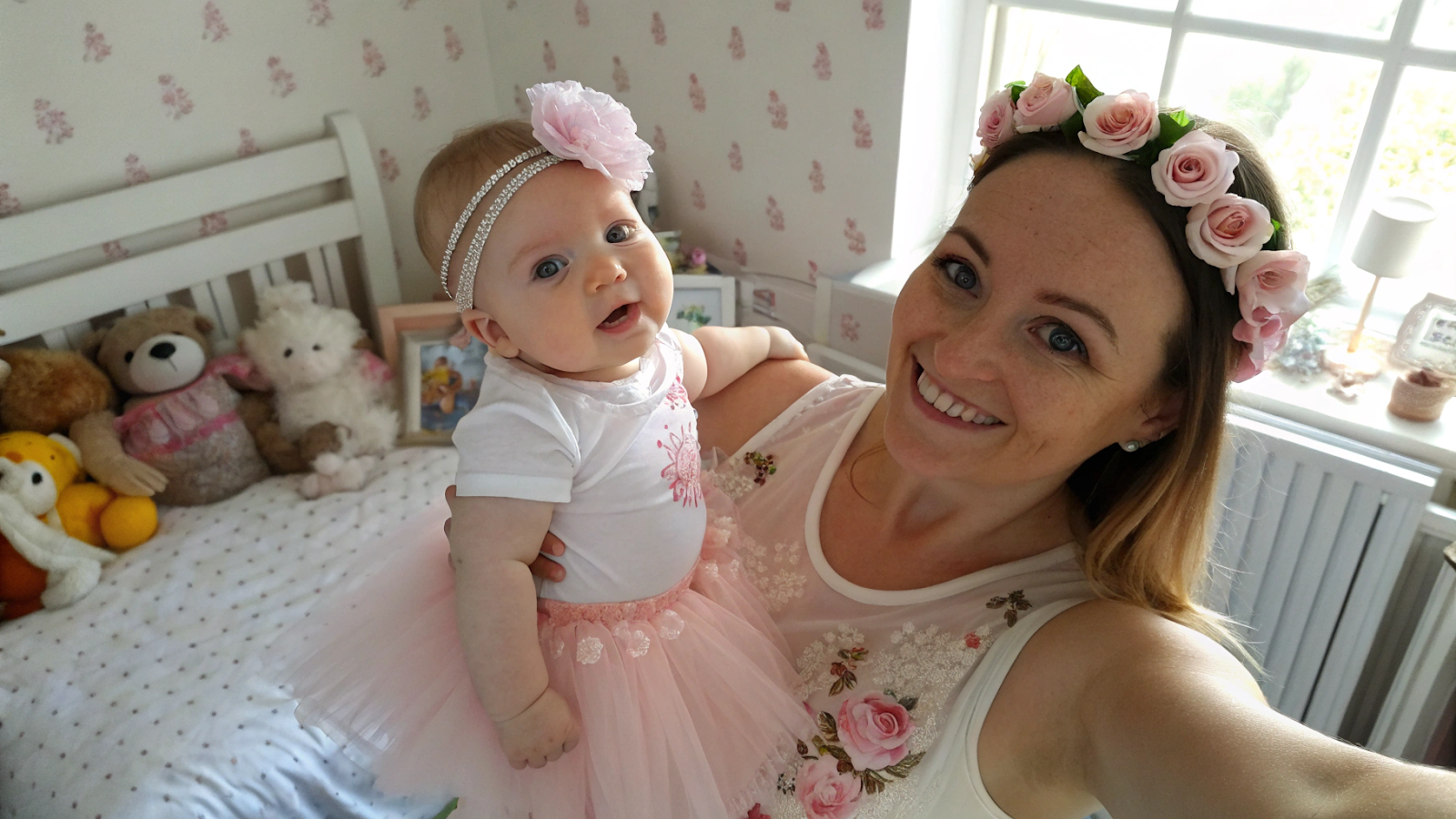 one-month-old baby in white onesie