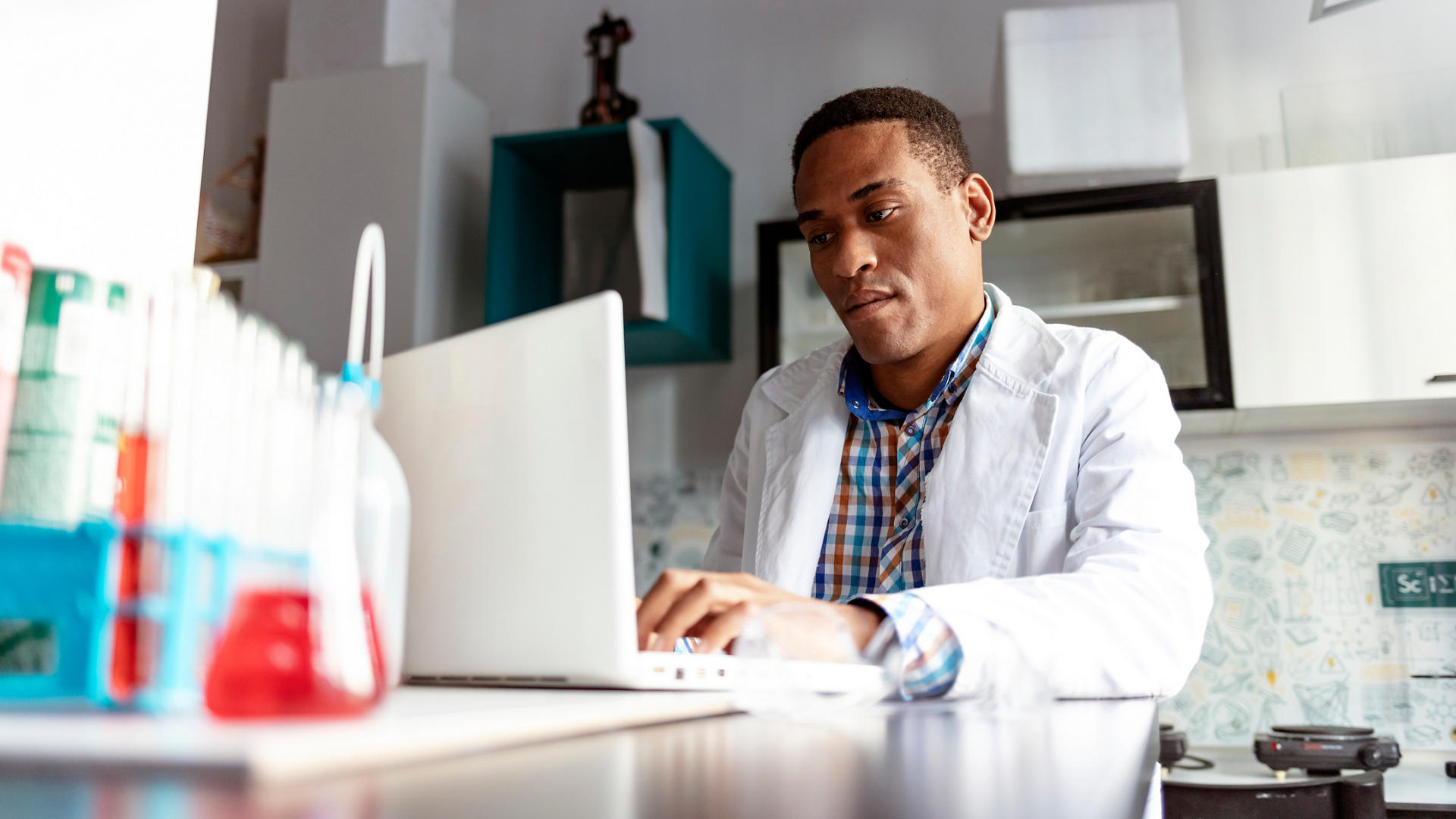 Scientist using computer in laboratory