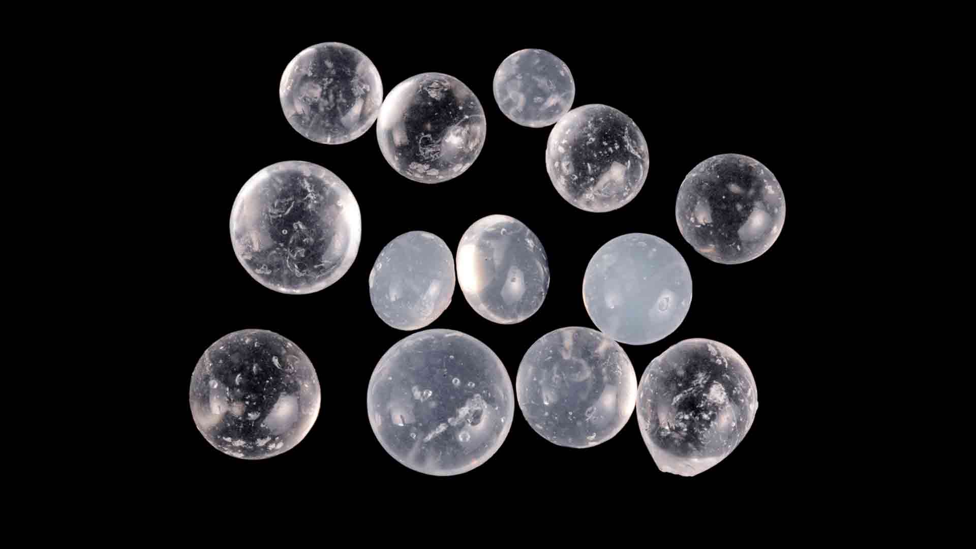 Silica gels balls against a black background