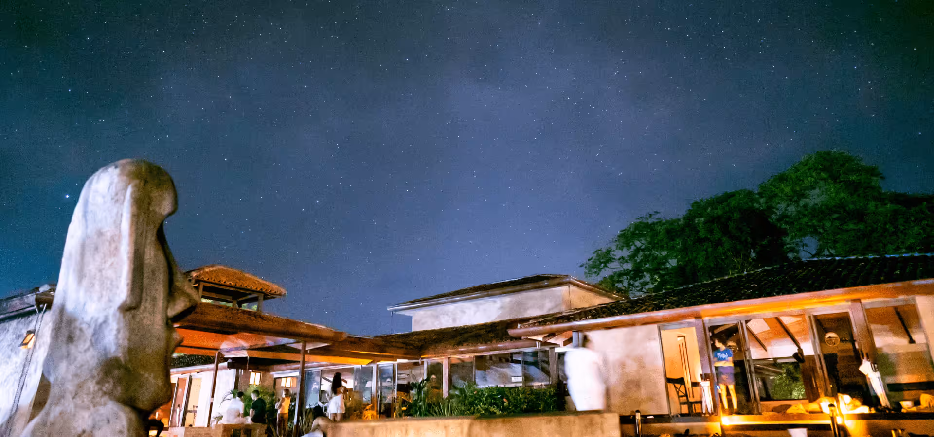 A night time view of the sacred Maloca at Rythmia