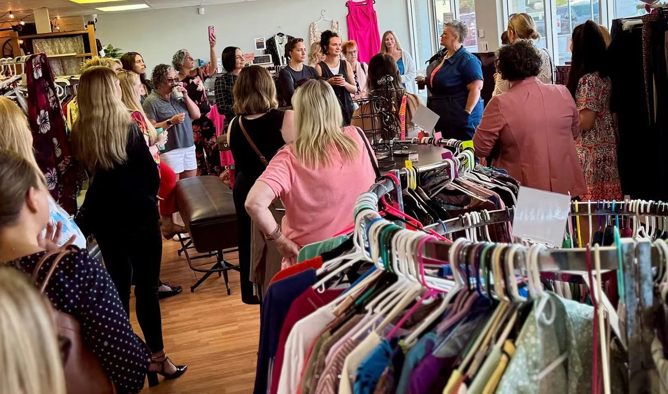 Community event at Switch Society thrift store with customers gathered for a sustainable fashion talk.