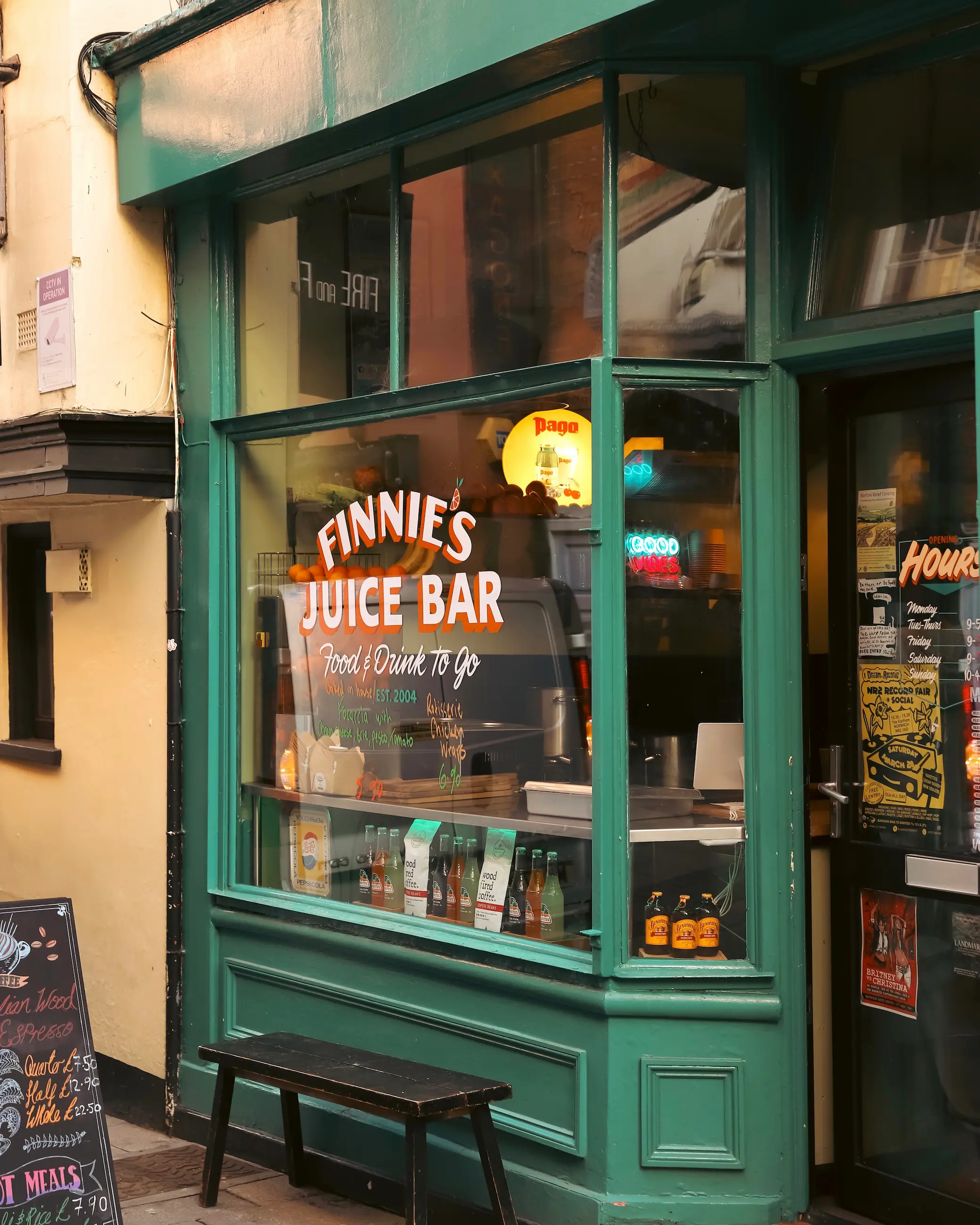 Exterior of Finnie’s Juice Bar in Norwich, with green shopfront, window signage and drinks displayed inside.