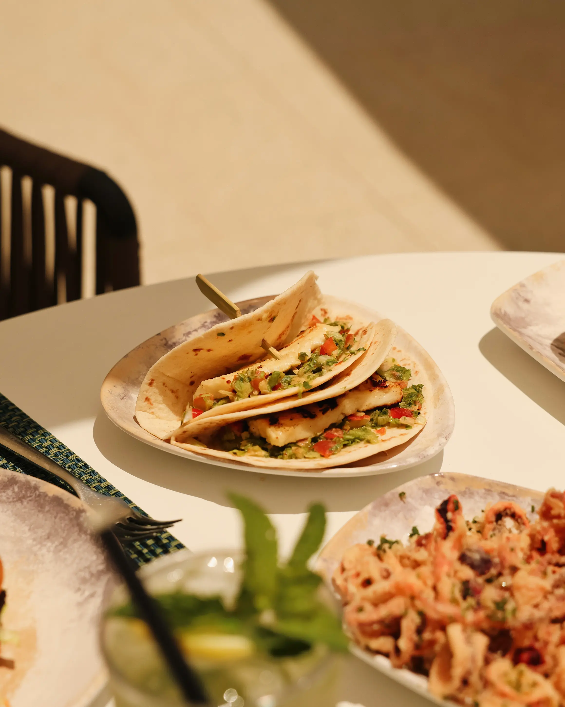 Halloumi tacos topped with fresh salsa served poolside at Malta Marriott Hotel & Spa in St Julian's, Malta, during a sunny afternoon.