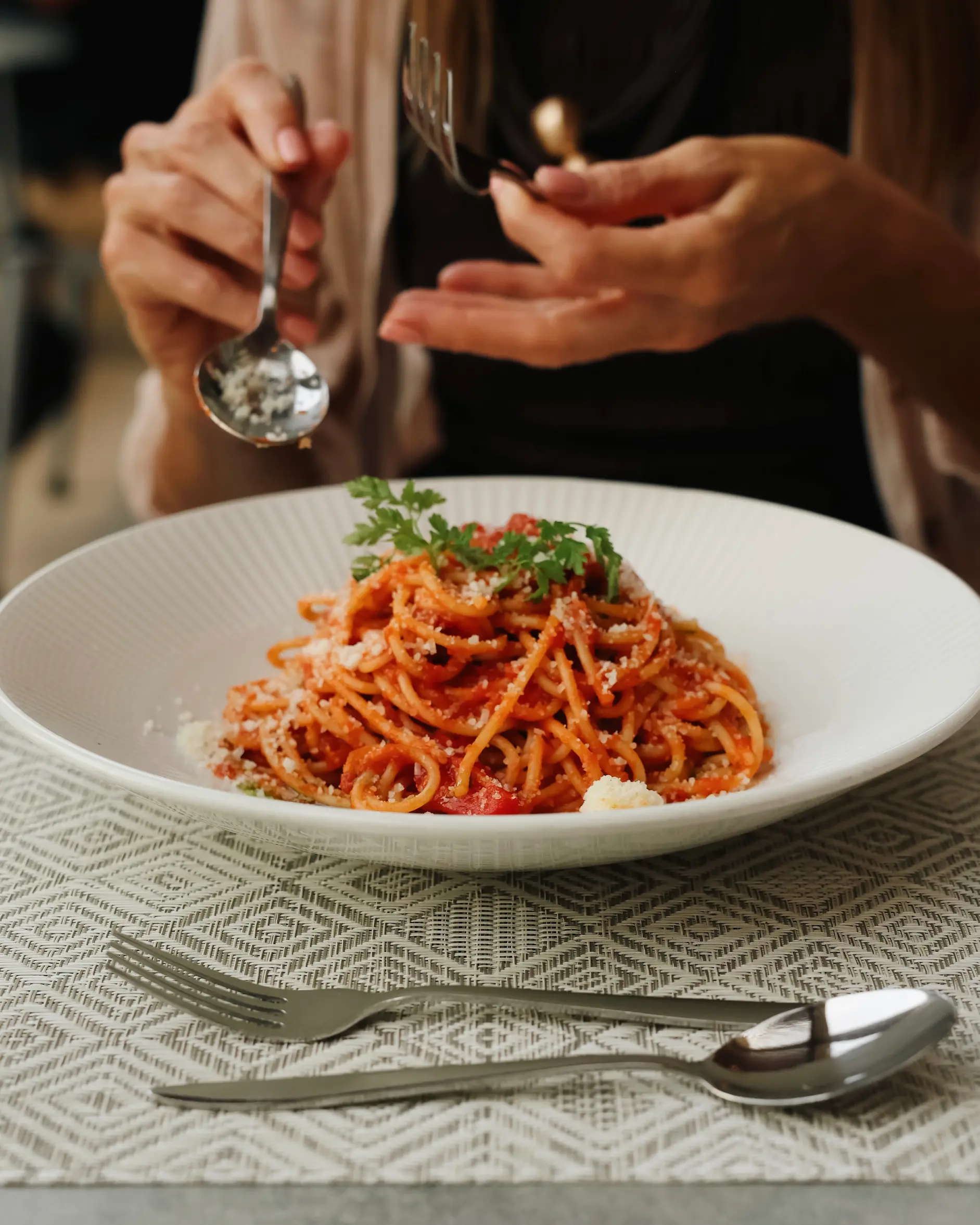Plate of tomato pasta being served at Amada Colossos Resort in Rhodes, Greece.