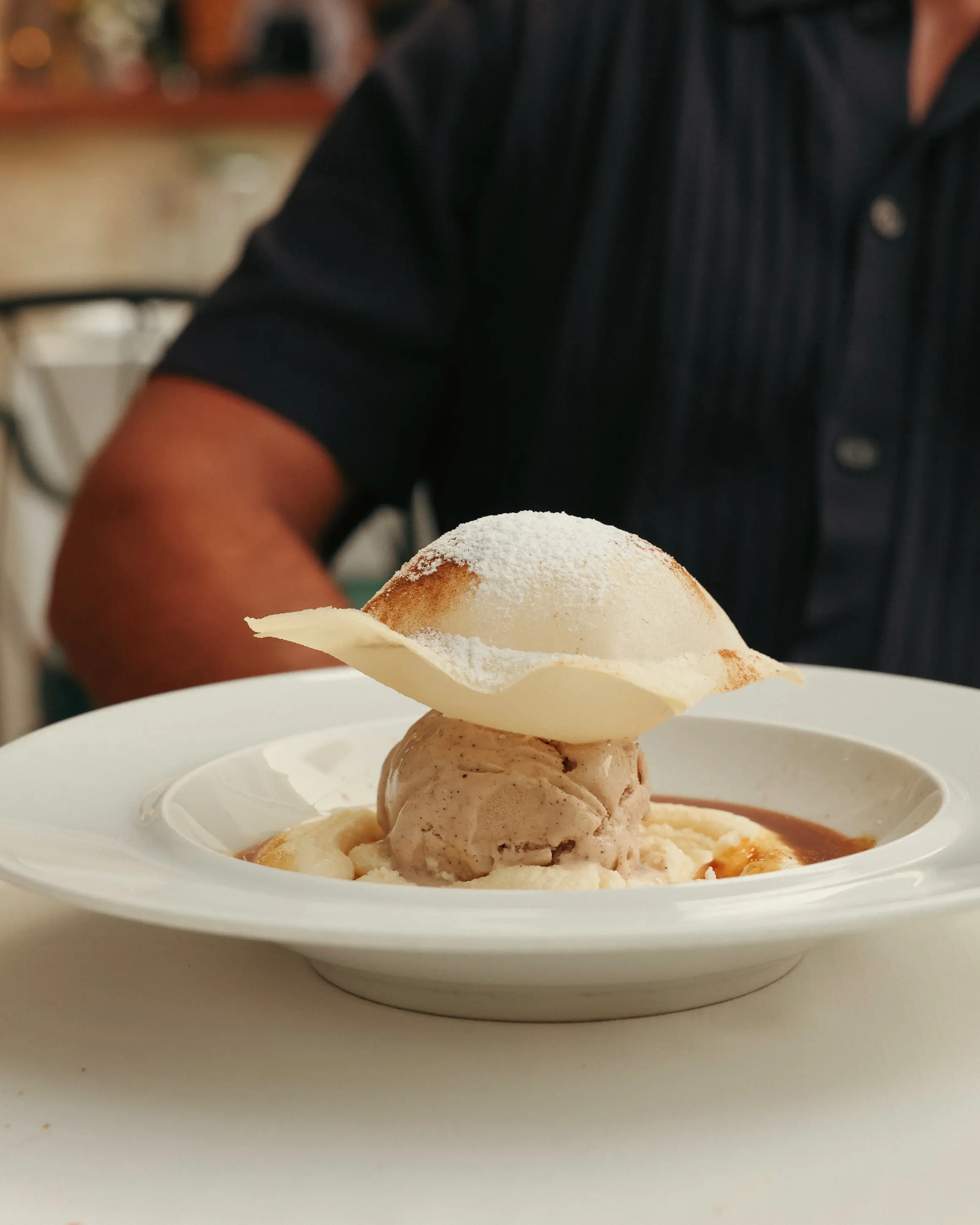 Dessert served at Rodos Park in Rhodes, with ice cream, cream and a delicate white chocolate shell.