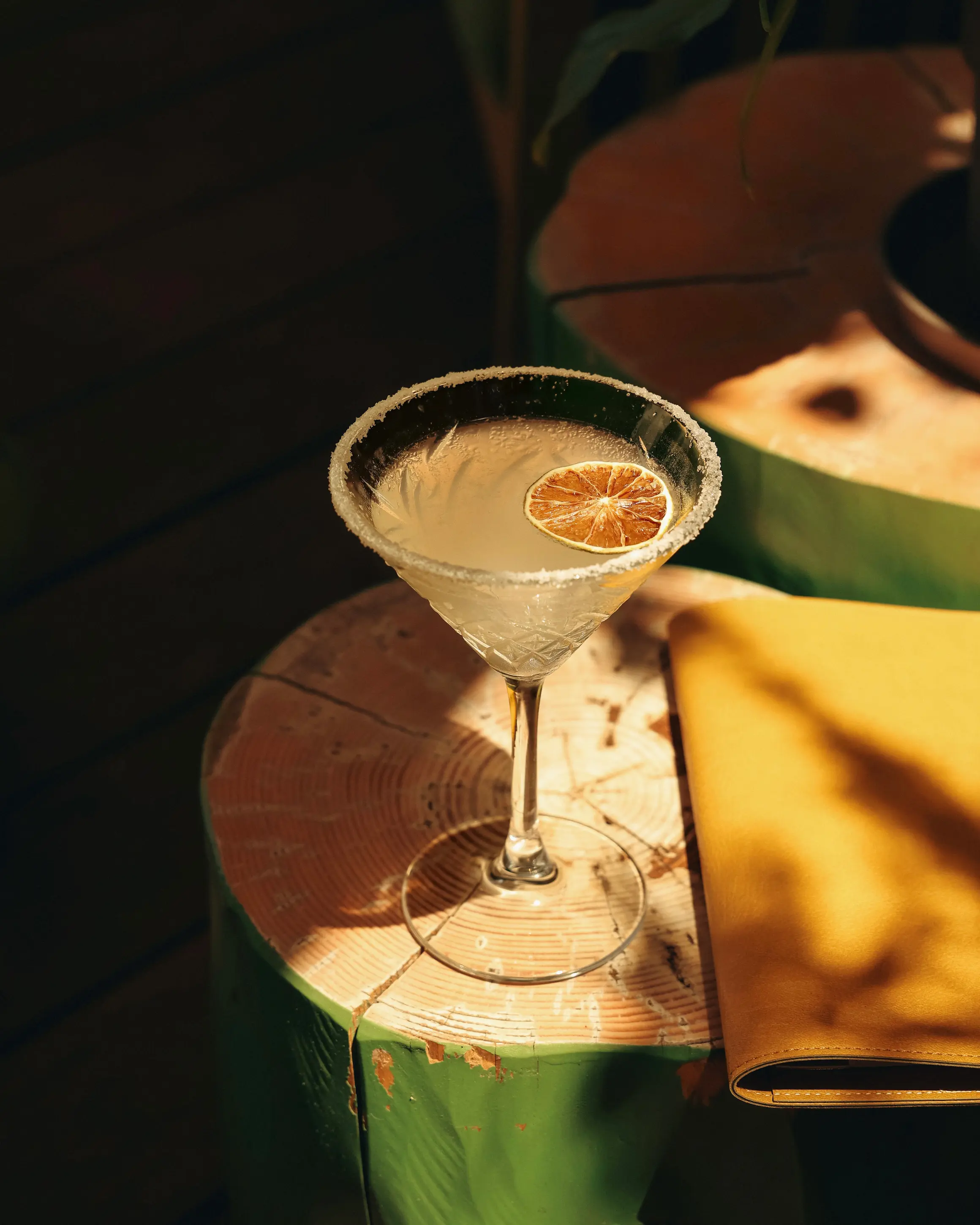 Citrus cocktail served in a coupe glass with a sugared rim and dried lime at Rodos Park in Rhodes.
