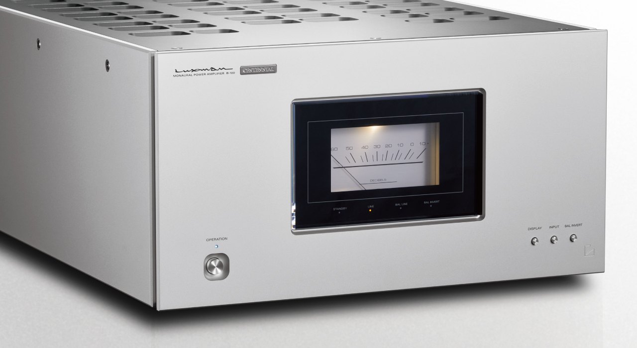 Luxman B-100 Centennial monaural power amplifier in silver, with its large lit analog meter