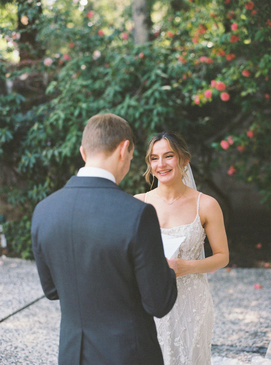 film photo of a brides reaction to her groom reading his private vows to her 