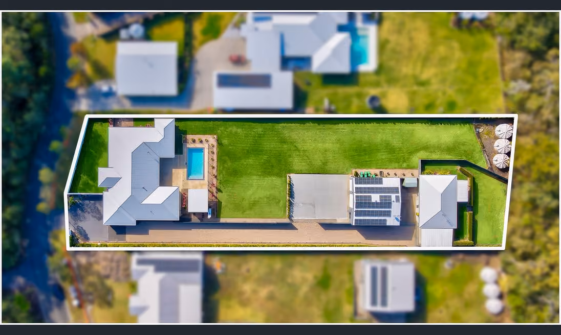 Noble Estate Agents proudly present 40 Glassing Avenue, Palmview Forest, a remarkable property exuding casual elegance on a premium acre of land with a serene treed outlook.