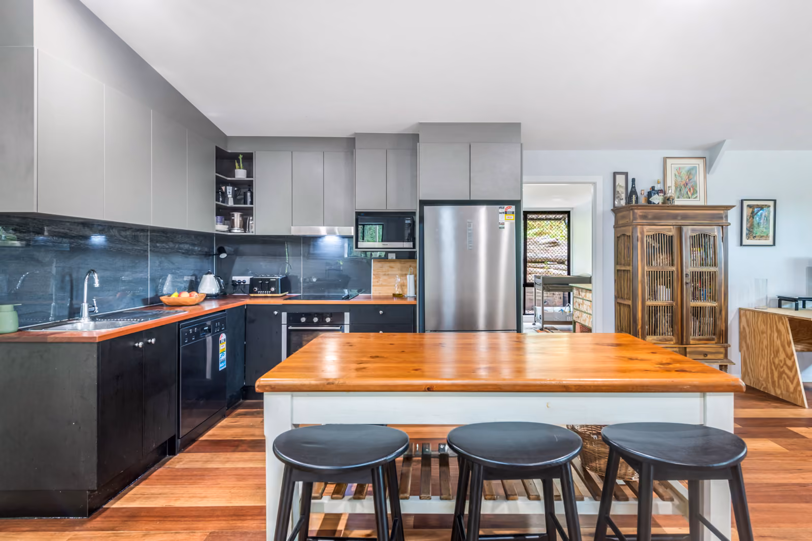 This tranquil property sprawls across just under 2 acres of natural forestry, featuring two distinct residences meticulously designed for privacy, scenic outlooks, and a connection with nature. A captivating property, full of charm and countless possibilities.