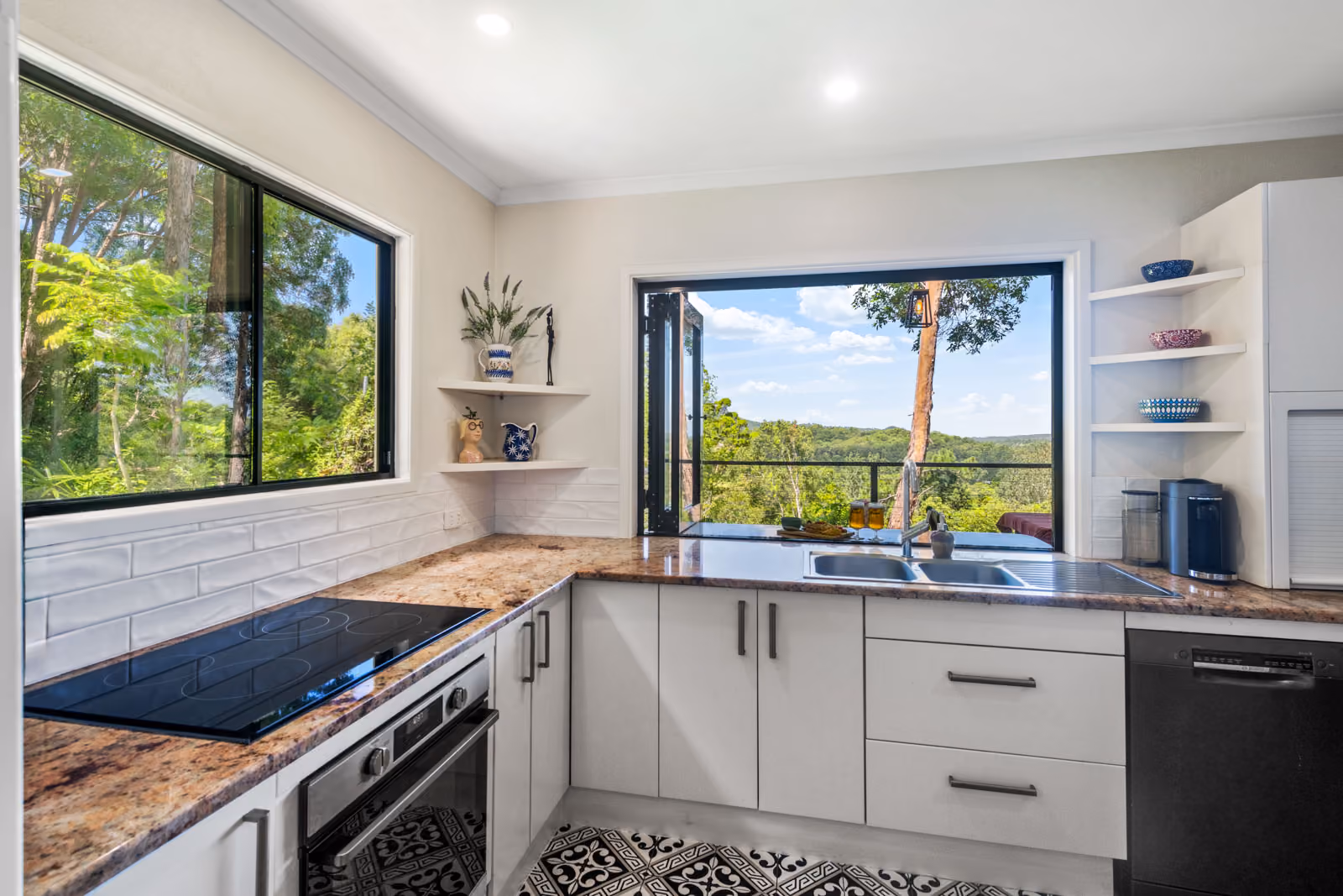 Welcome to 78 Andersons Road, Yandina, where tranquillity meets modern living in a stunning natural setting. As you enter via the long concrete driveway, a sense of serenity washes over you, signalling your arrival at this private retreat. The true showstopper, however, reveals itself in the form of the large outdoor entertaining deck. This expansive deck, seamlessly merges indoor and outdoor spaces and offers panoramic views of Mount Ninderry and lush greenery—a perfect backdrop for any occasion.
