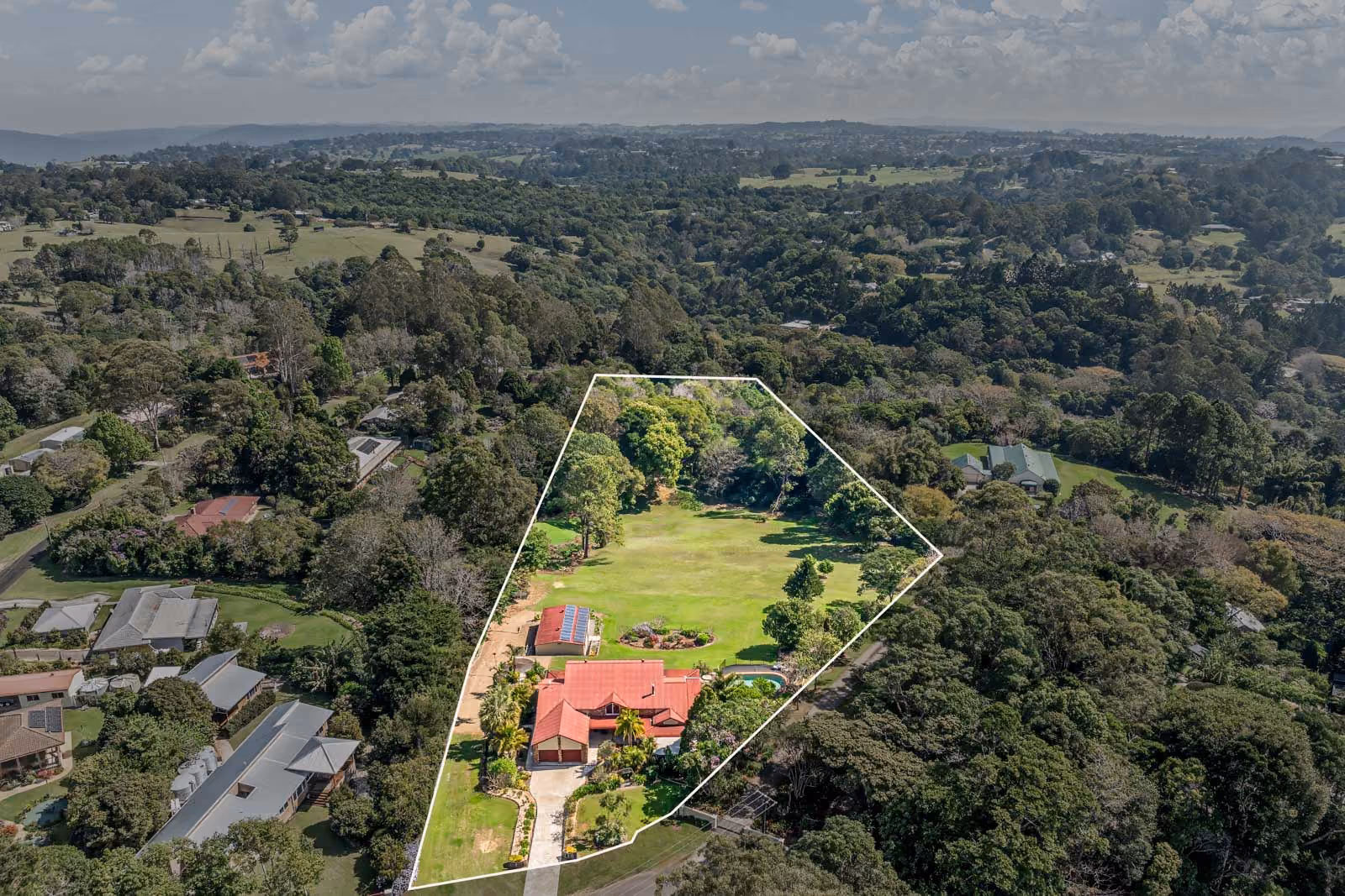 Perched on a lush 4-acre lot, this stunning 5-bedroom, 3-bathroom home offers spectacular views over the Maleny Golf Course and hinterland. 