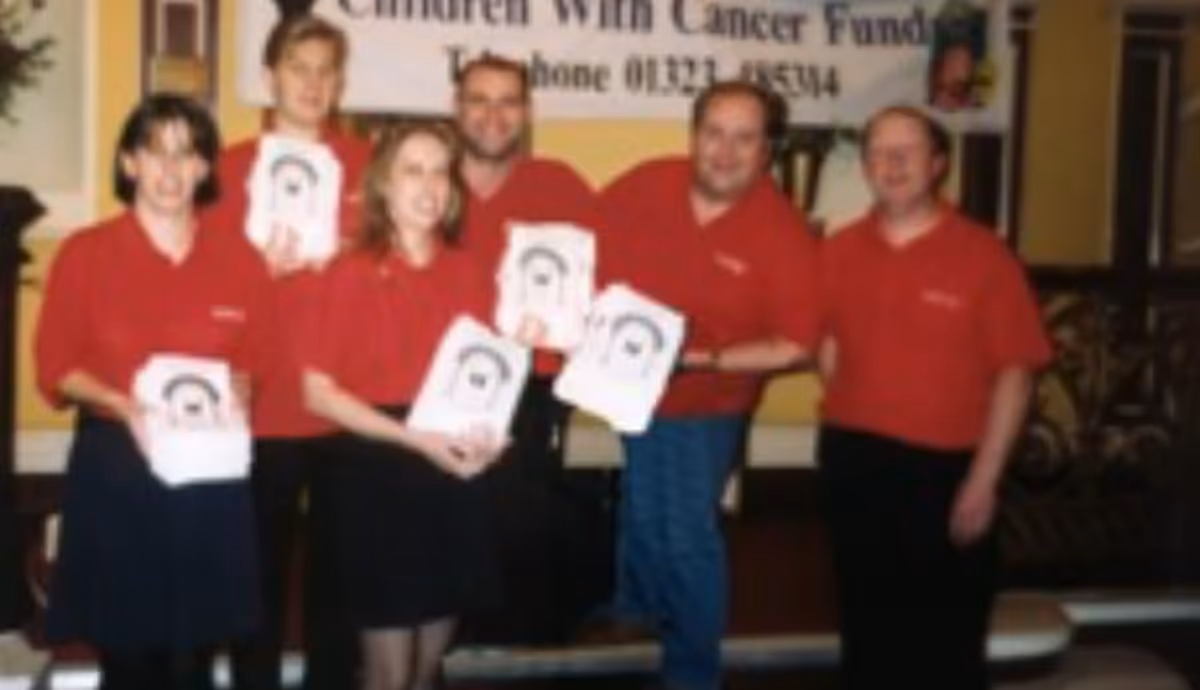 A group of people standing next to each other.