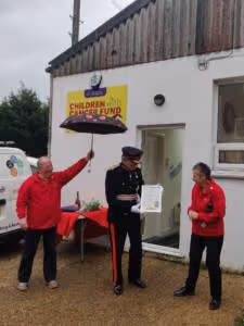 A group of people standing outside of a building.