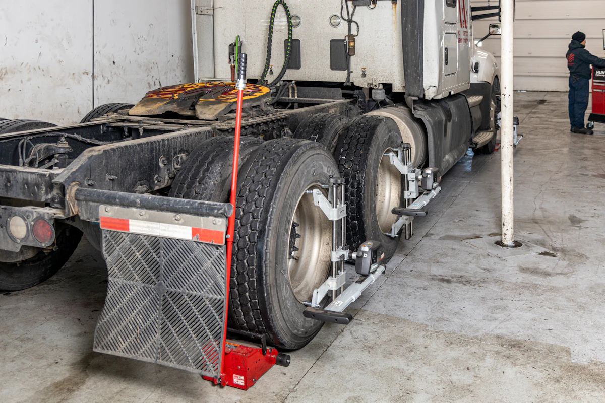 Mechanic performing alignment service for trailer in Bolton, ON