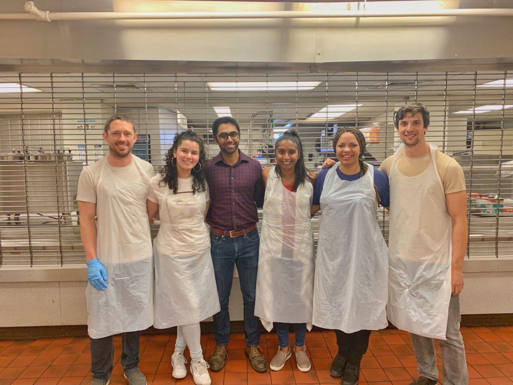 A group of Envoy employees volunteering at St. Vincent de Paul Society helping to serve lunch to people in San Francisco experiencing homelessness. 