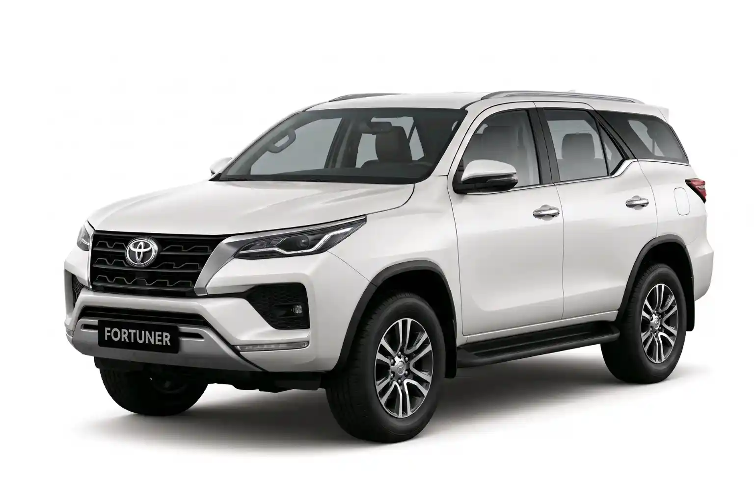 White Toyota Fortuner SUV viewed from the front side on a white background.