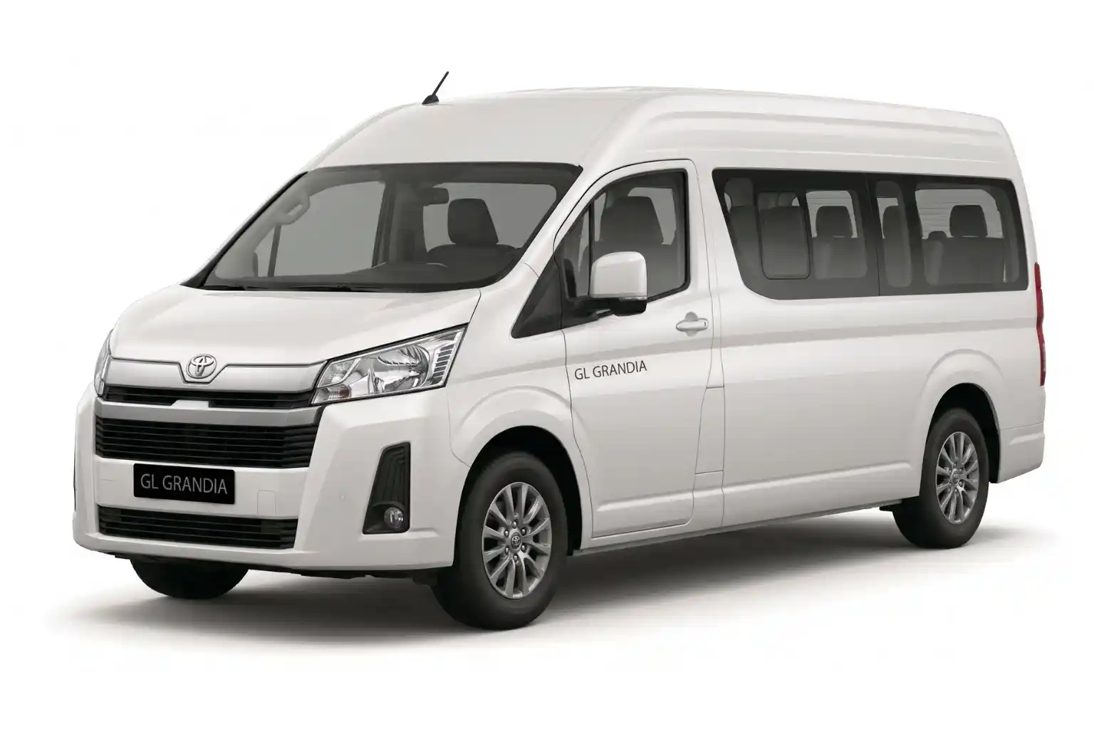 White Toyota GL Grandia van viewed from front left angle on white background.