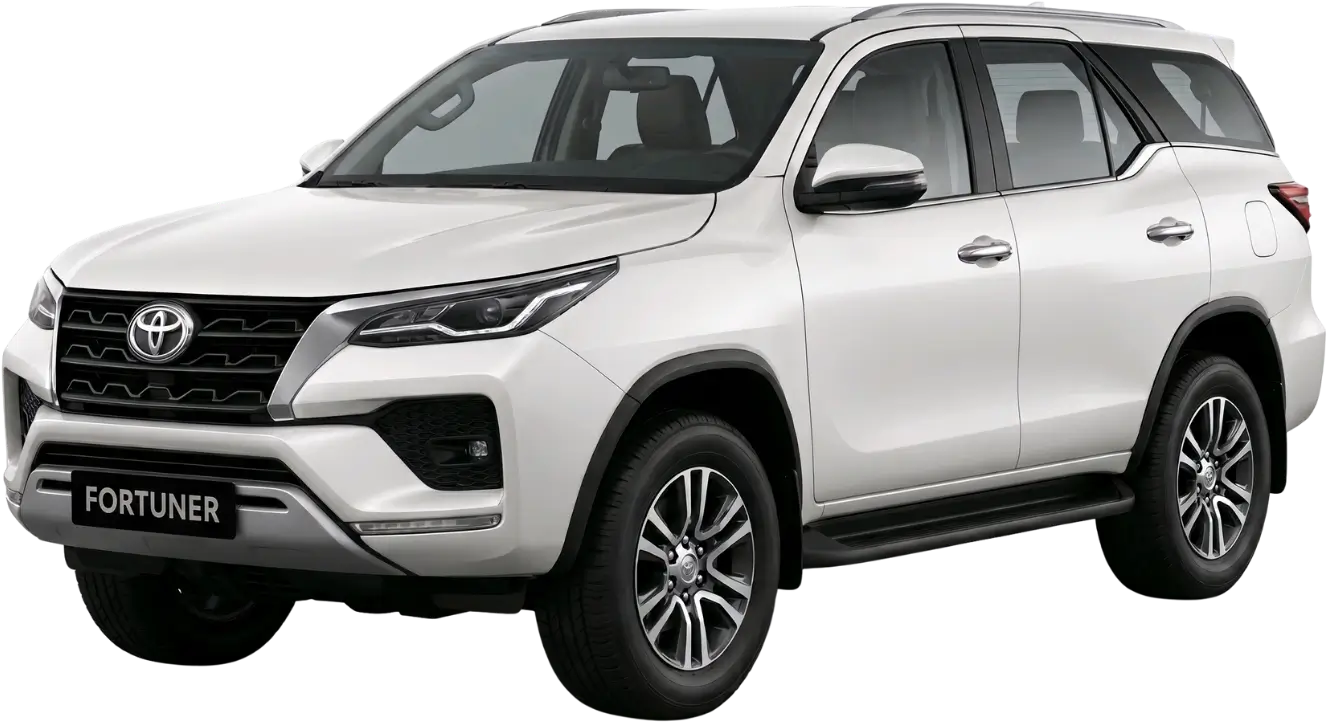 White Toyota Fortuner SUV shown from front-side angle with black grille and alloy wheels.