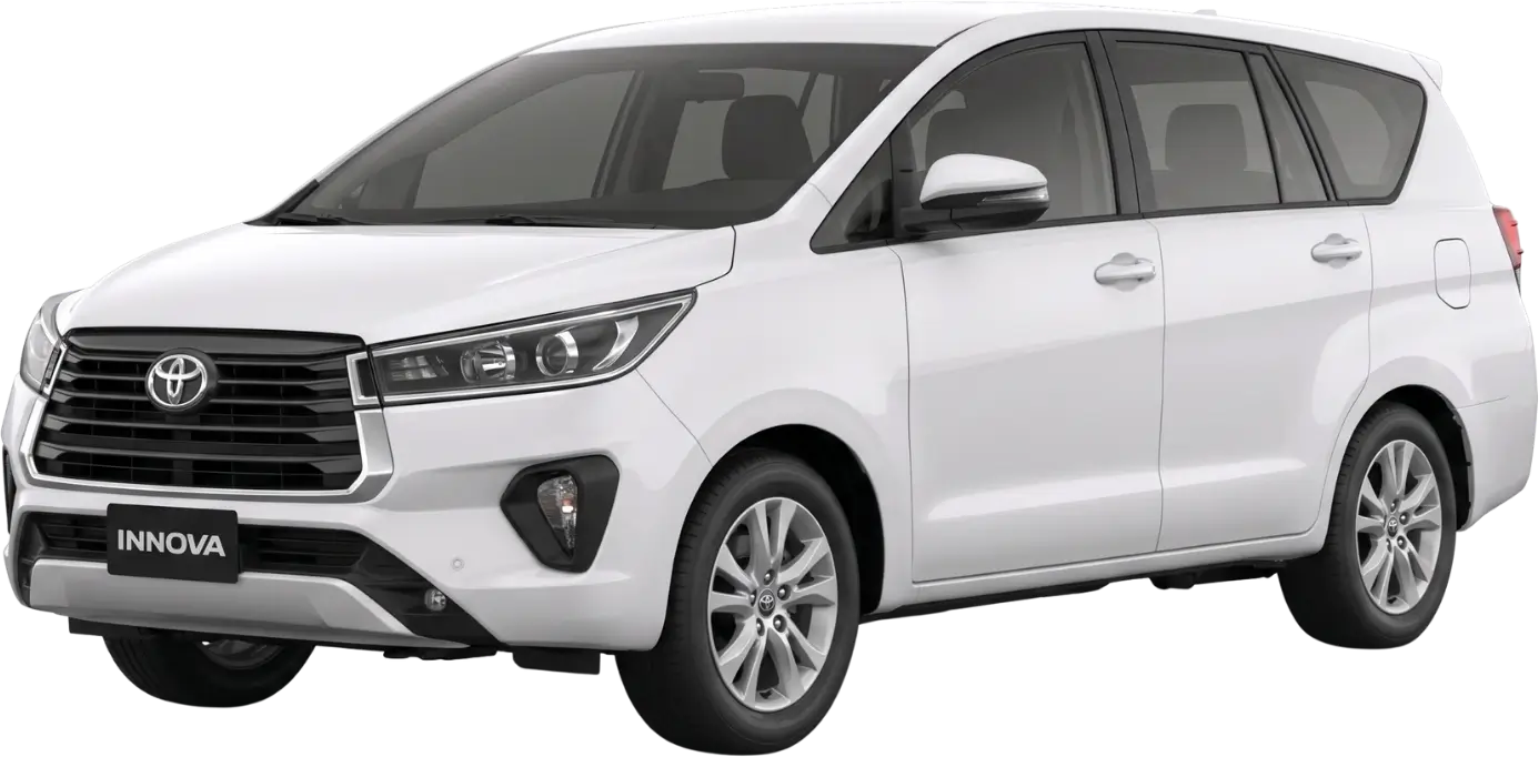 White Toyota Innova MPV car viewed from front right side showing grille and wheels.