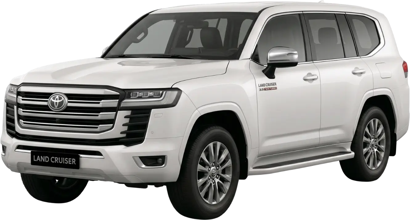 White Toyota Land Cruiser SUV viewed from the front right side with chrome grille and alloy wheels.