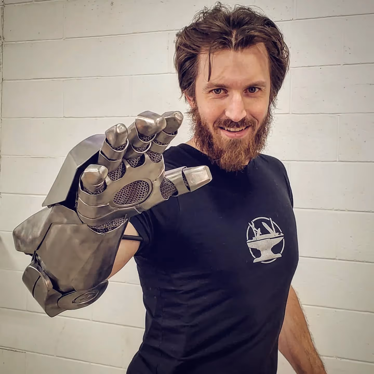 Photo of james wearing a gray Ironman fist