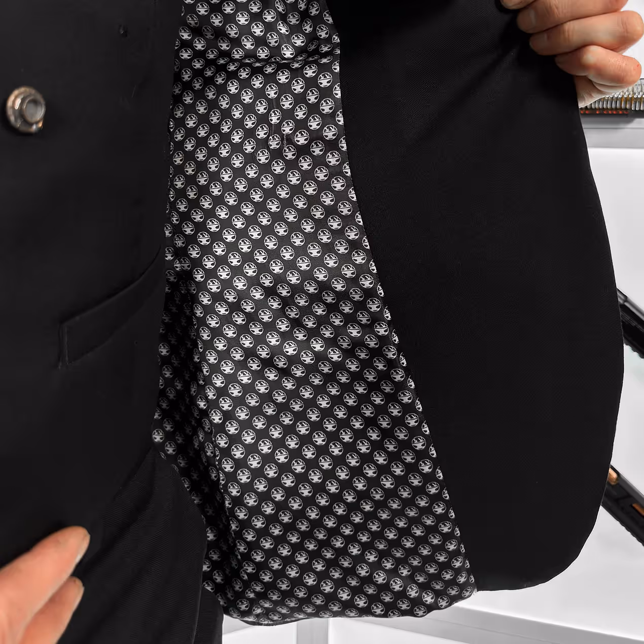 Inside of John Wick's bulletproof jacket with Hacksmith's logos