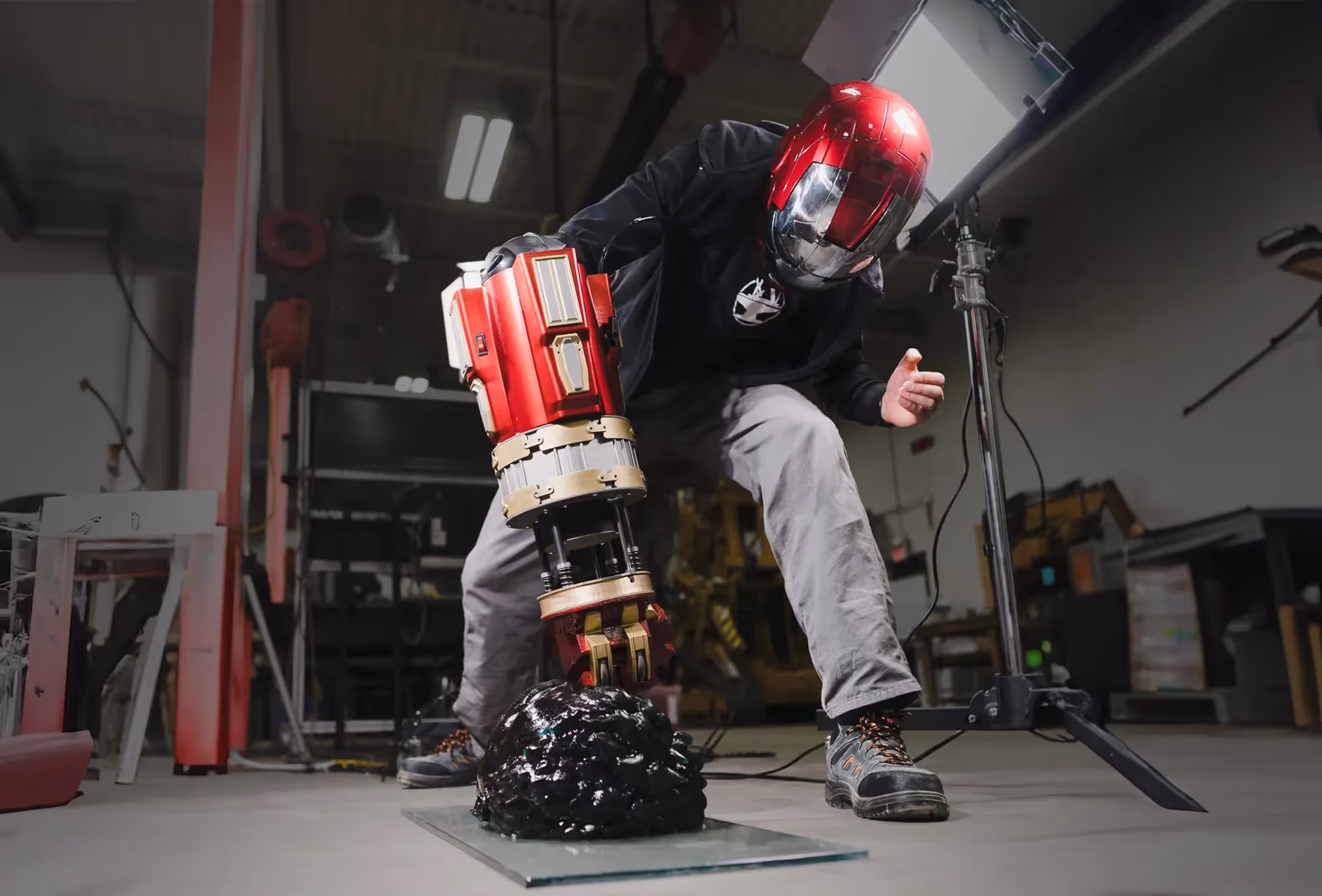 Hacksmith team member using Ironman fist and helmet