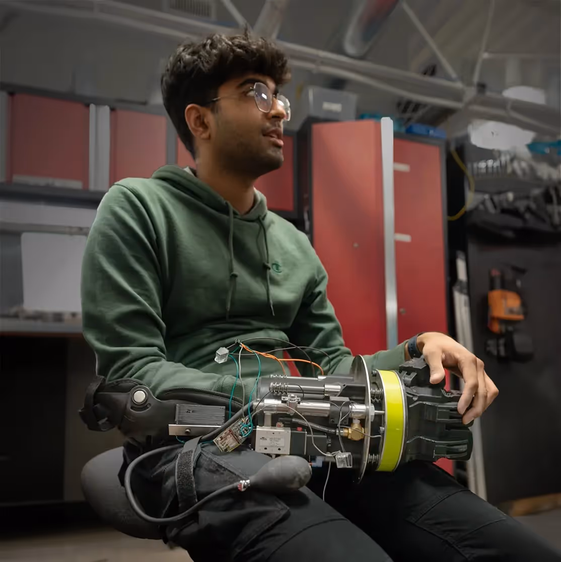 Hacksmith team member chilling wearing a prototype of the Ironman fist