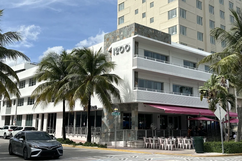 art deco building exterior with palm trees at 1200 ocean drive in miami beach