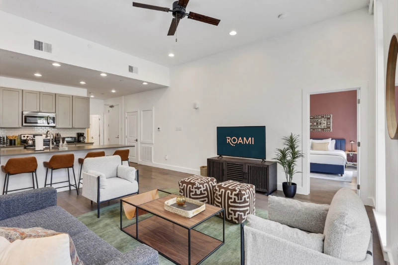 open plan living room and kitchen with breakfast bar at bourbon place by roami