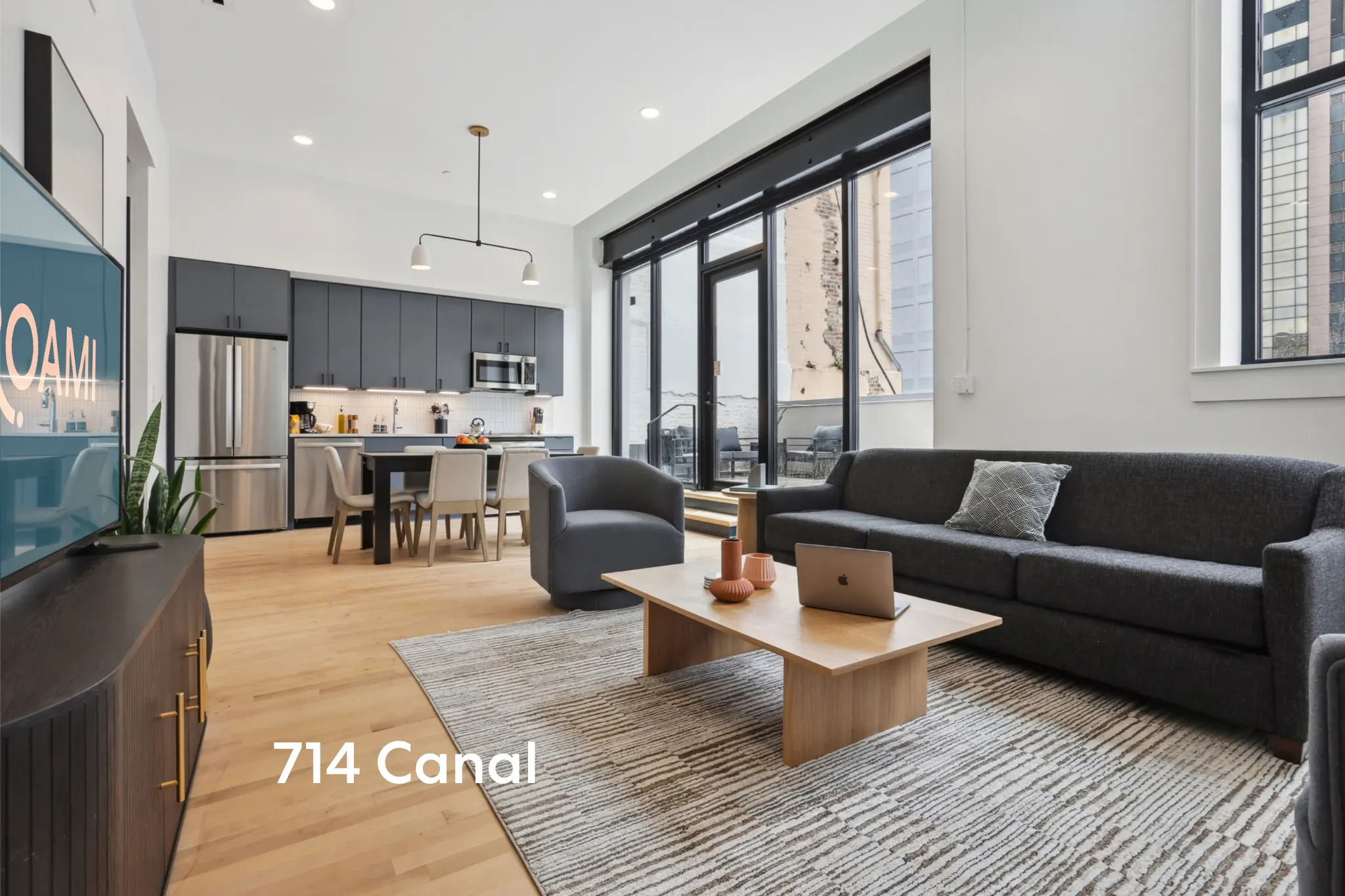 modern open plan living room and kitchen at 714 canal in new orleans