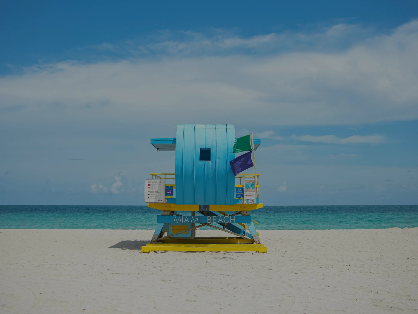 colorful lifeguard stand on a sandy miami beach