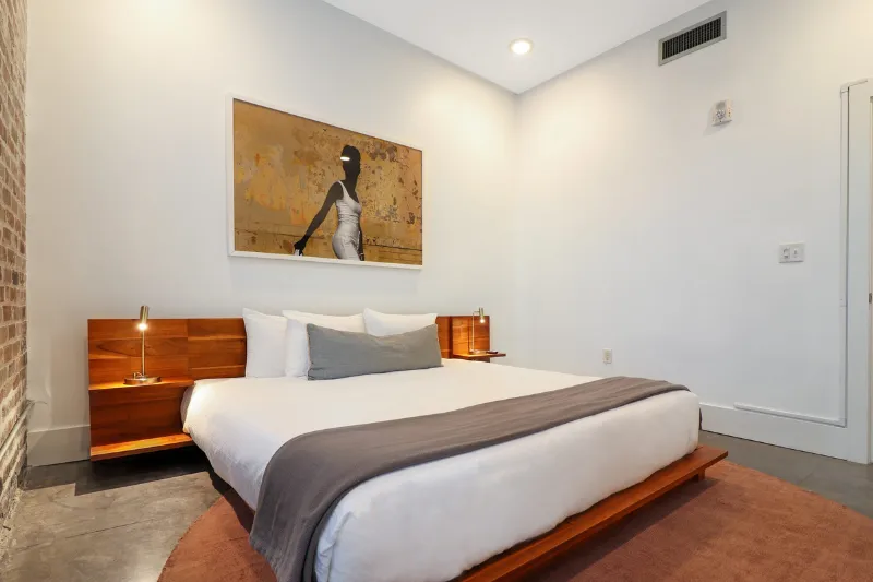 bedroom with platform bed and wall art at motorworks by roami