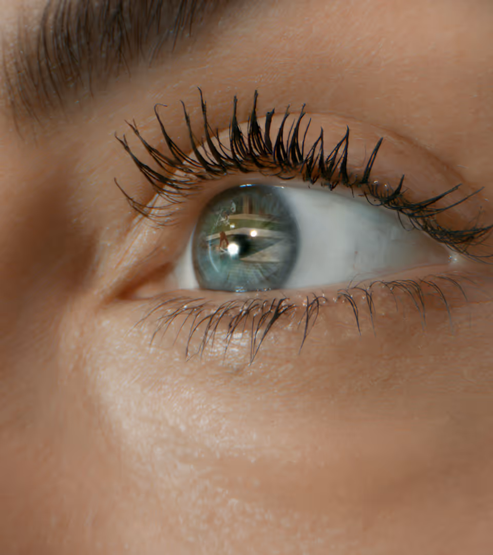 a close up of a person's eye with long lashes