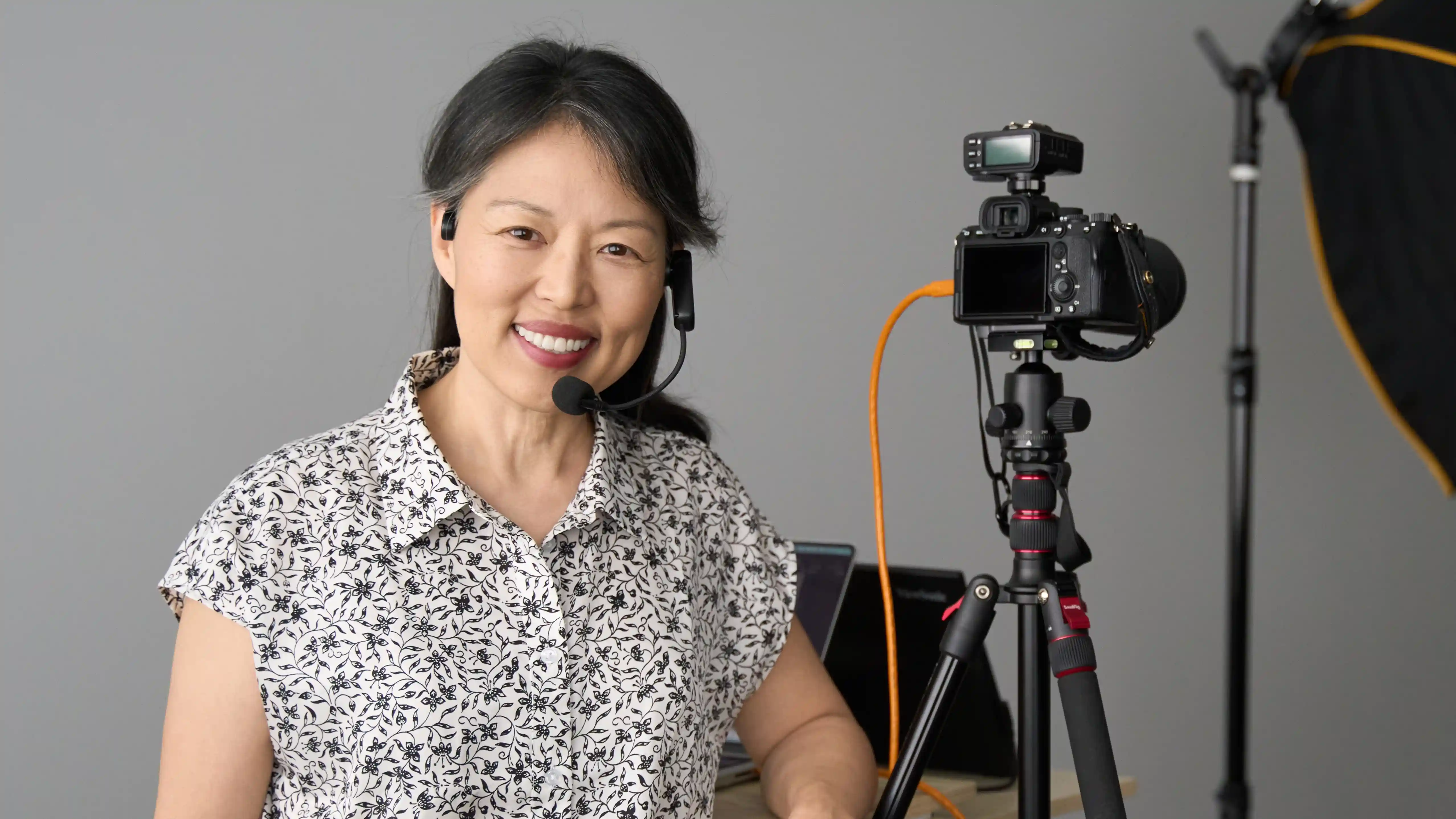 Image of photographer in front of tripod in studio