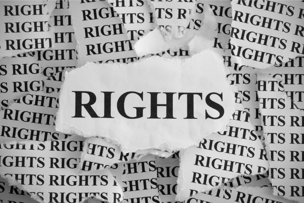 The word ‘RIGHTS’ written repeatedly on paper in black, capital letters