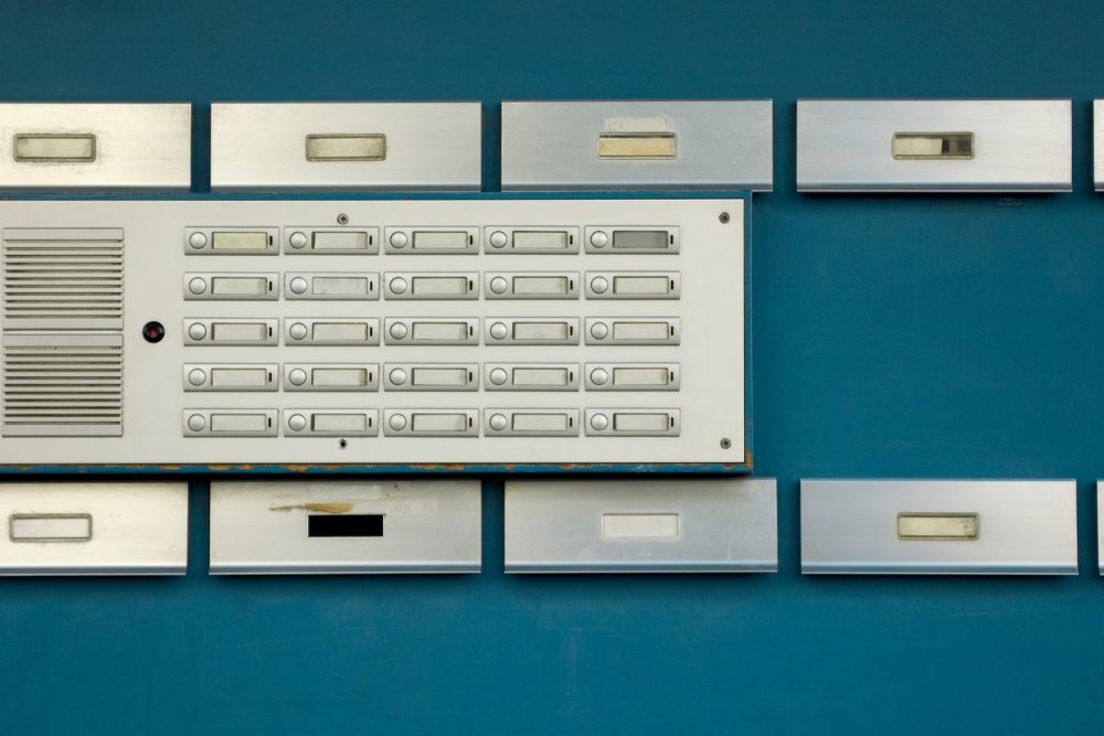 Mailboxes and buzzer panel illustrate the dynamics of rent regulation in NYC