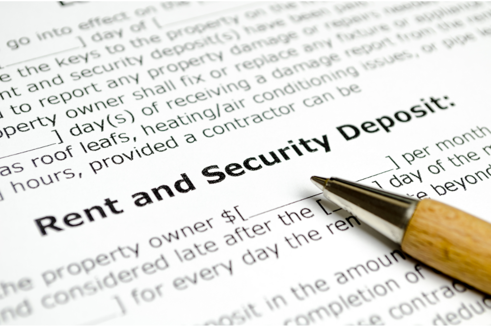 Rent and Security Deposit form with a wooden pen