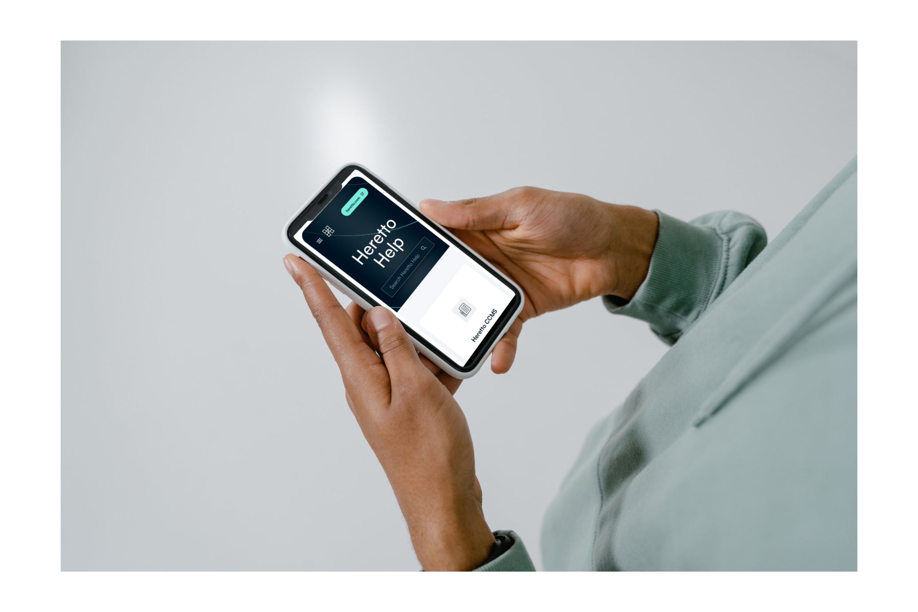 photo shows smartphone screen with Heretto User Guides as one of the types of technical documentation