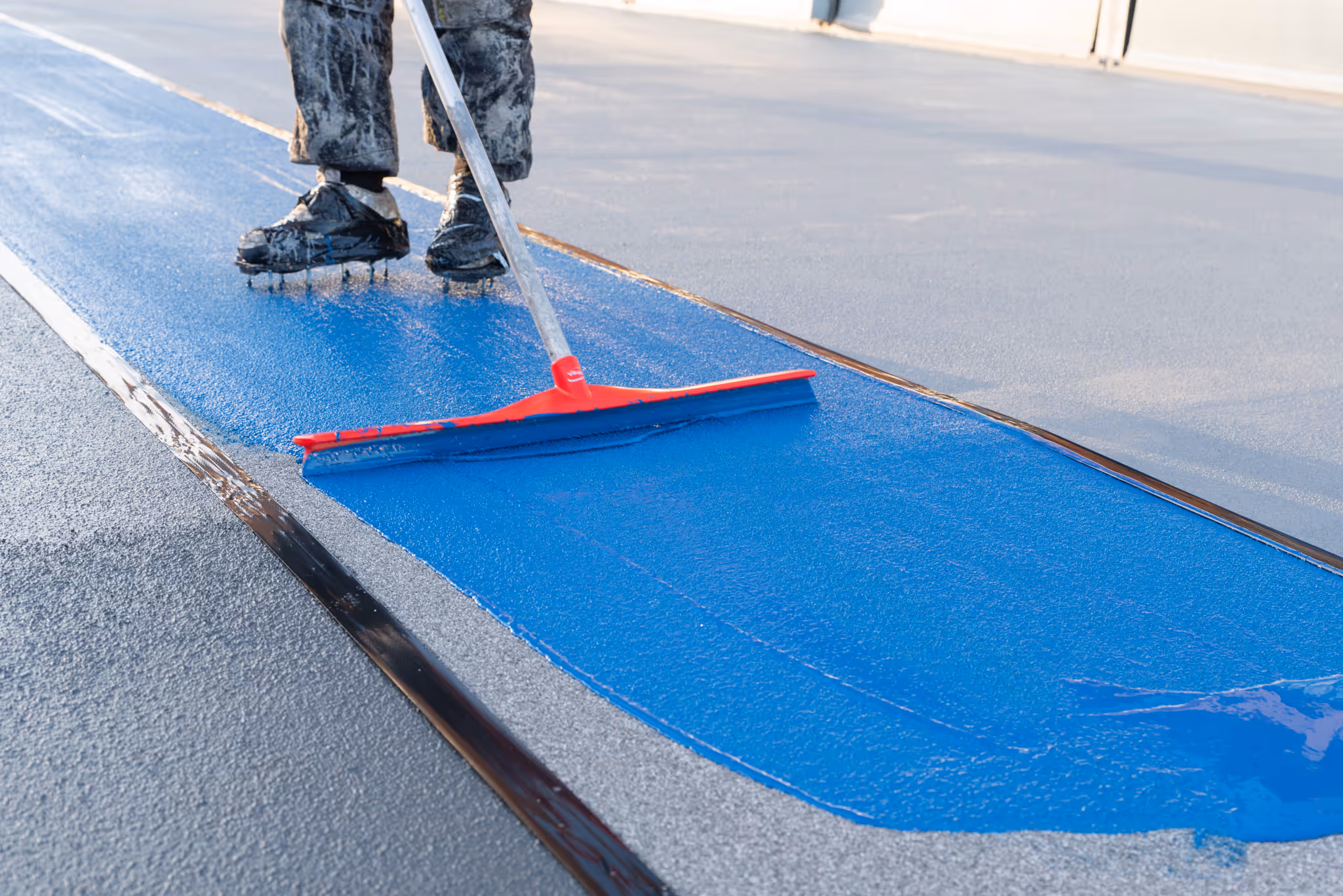 MTF Staff working on a car park resin flooring