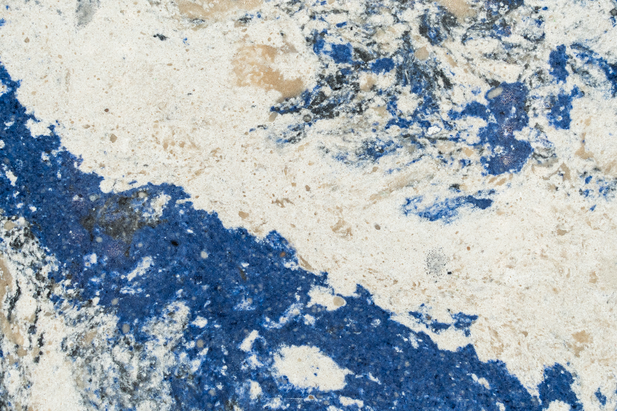 Blue and white swirled quartz slab.