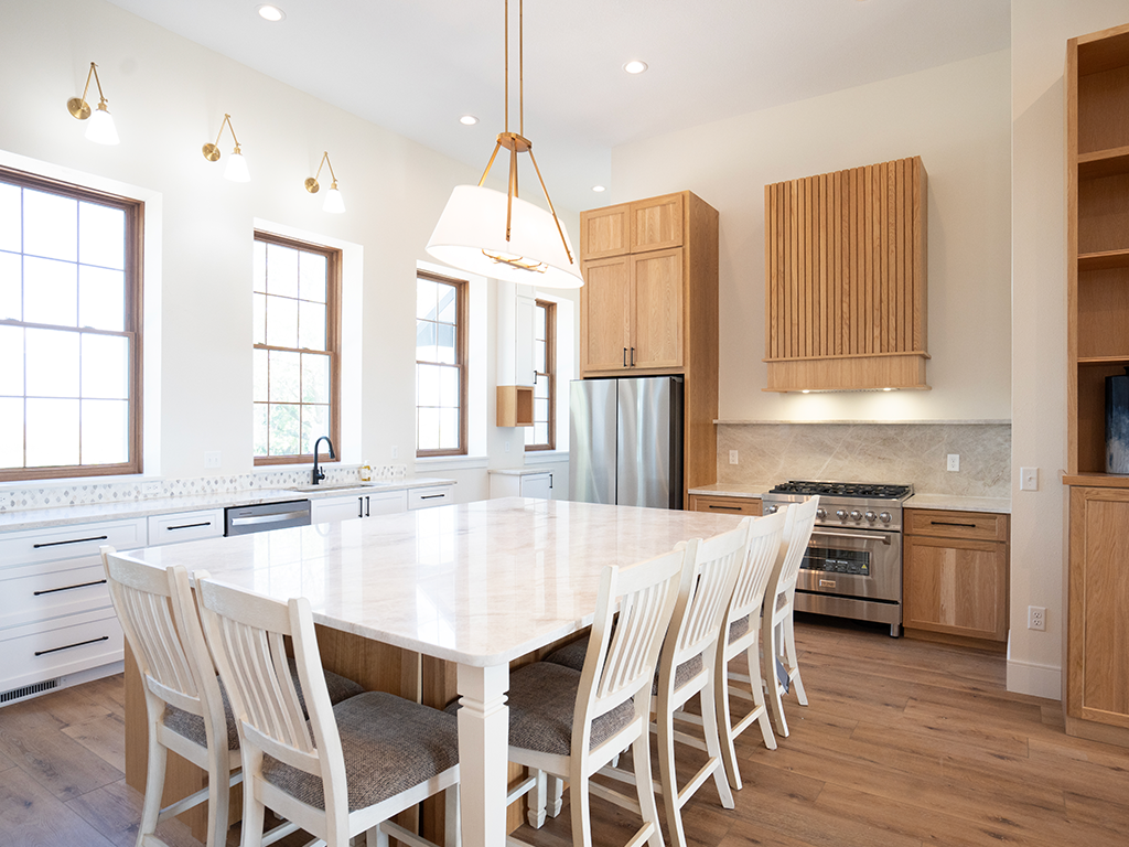 Modern Farmhouse Kitchen: Taj Mahal quartzite kitchen countertop with wood accents in Lidderdale, IA - Quartz Impressions