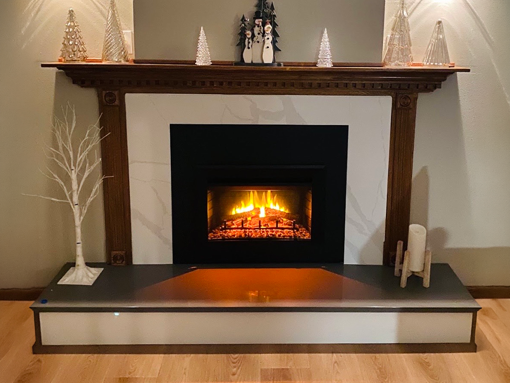 Quartz Fireplace Surround: White quartz fireplace surround with grey veining in Mitchellville, IA - Quartz Impressions