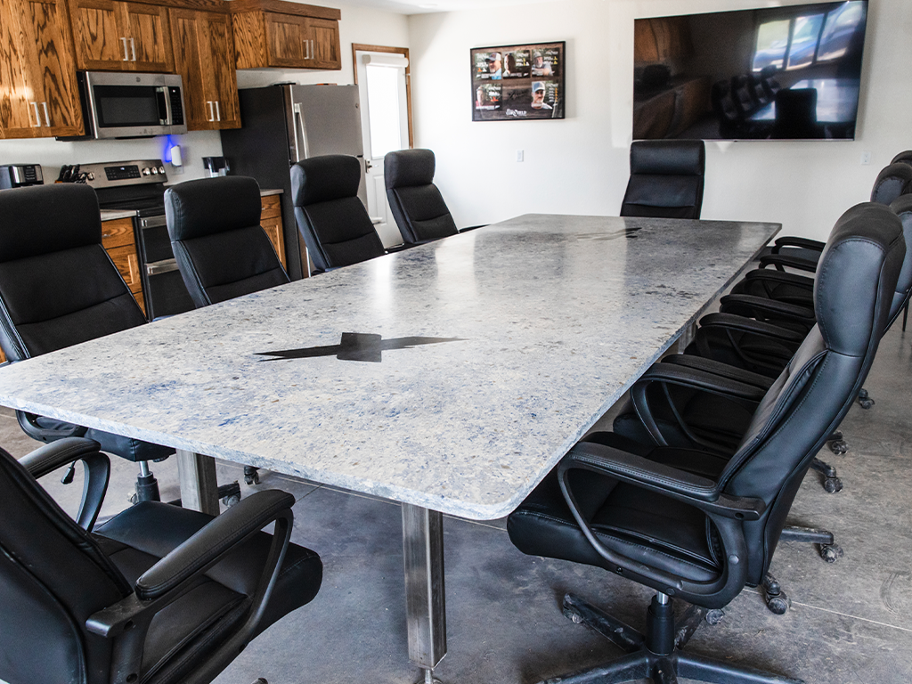 Corporate Conference Table: Custom fabricated quartz conference table for commercial office in Dow City, IA - Quartz Impressions